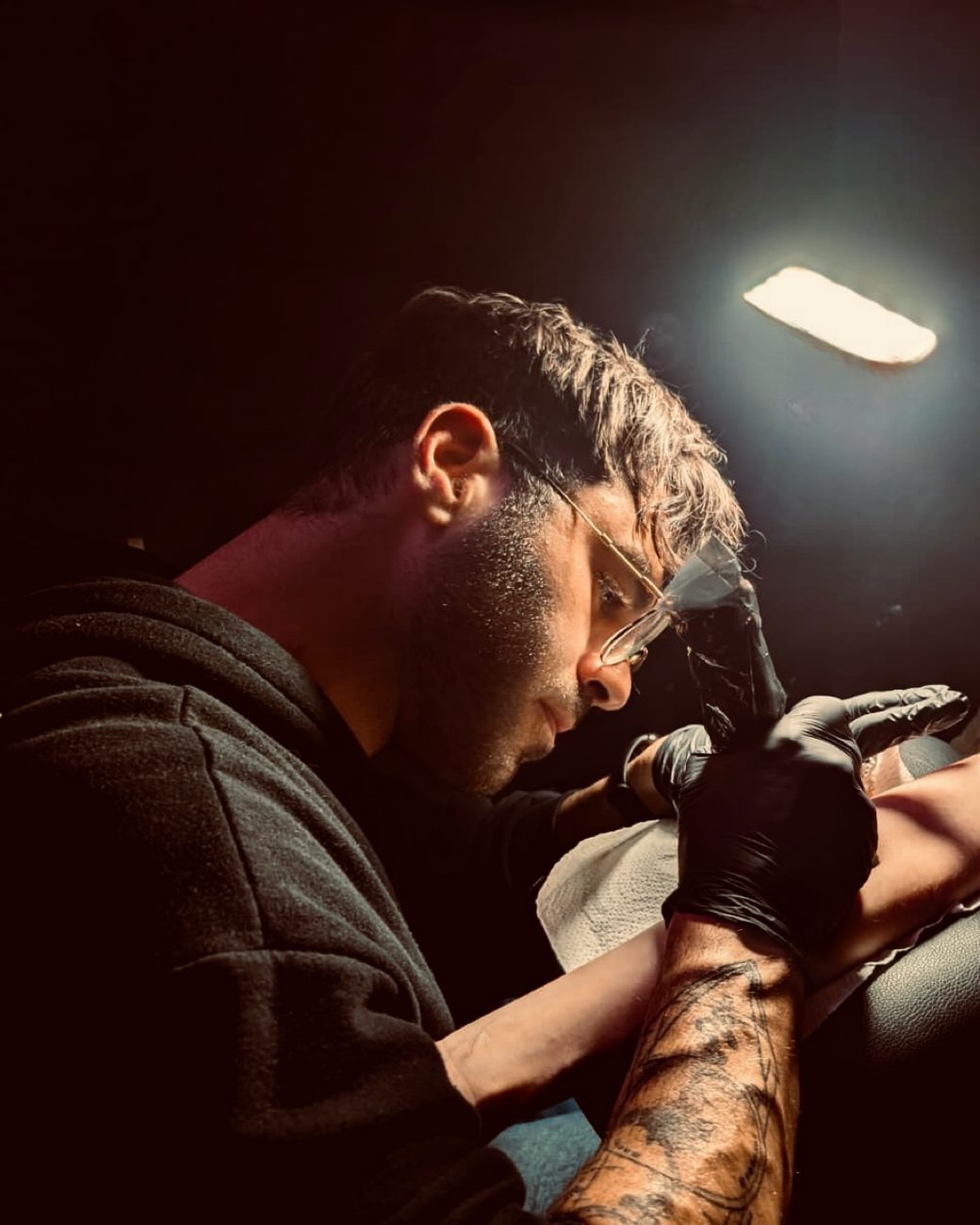 Ehab tattooing in the studio